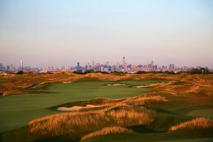 The Trump Ferry Point golf course is in the foreground with the NYC skyline in the background